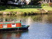 Narrowboat cruising on the River Thames, Staines, Middlesex, England